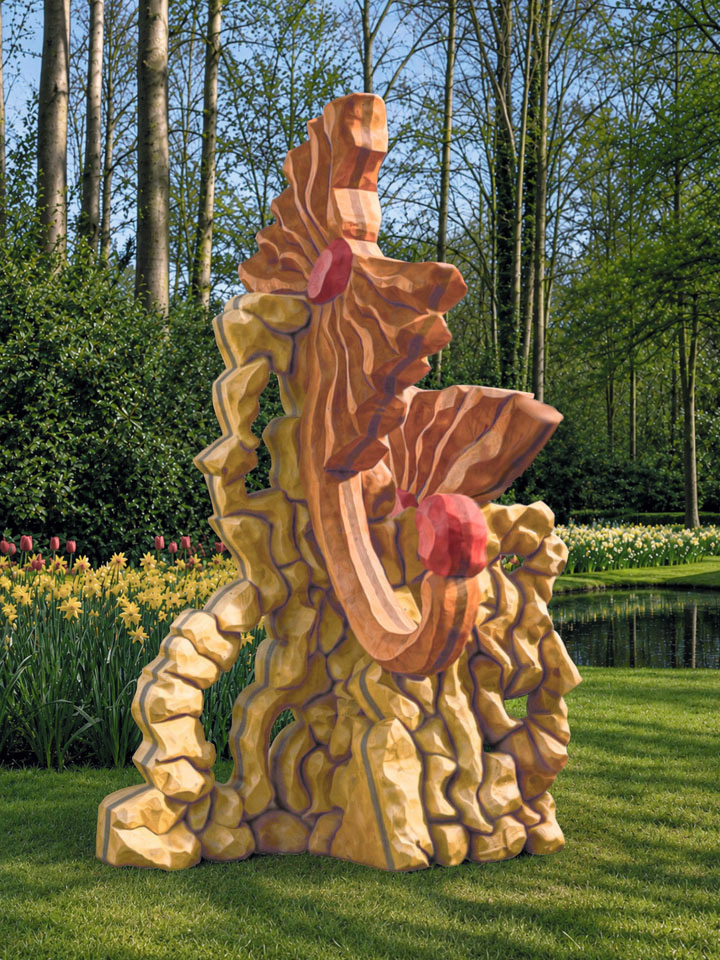 De Dahlia is opgebouwd uit strak op elkaar aansluitende keien van hout. Het draagt twee monsterlijke bloemen in de vorm van een vlinderstrik met een dikke rode knop in het midden. Een van de bloemen heeft een slurfachtig uitsteeksel met een derde rode knop.